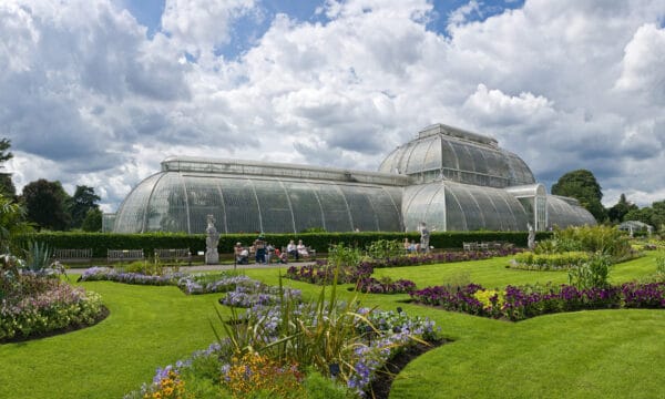 Outside view of the Palm House at Kew Gardens across the gardens